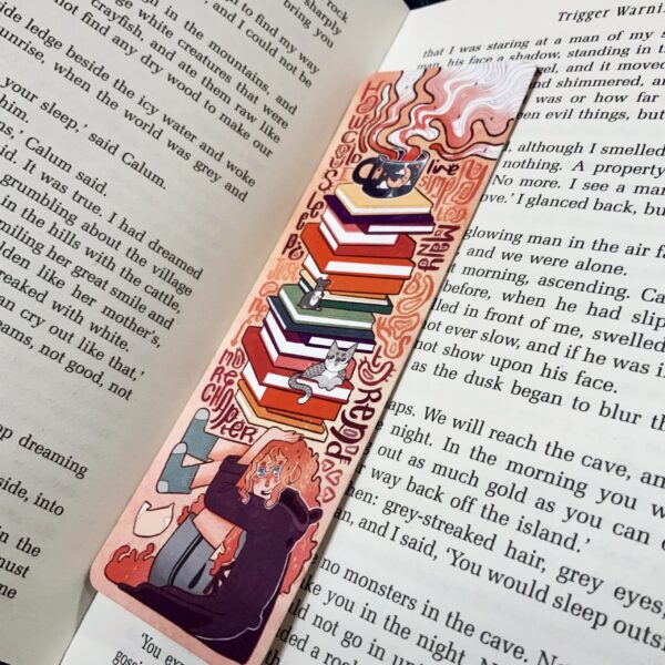 Keep your place in style with this bookmark featuring a book image. Ideal for your peach-themed reading list and a cup of tea!