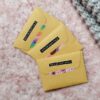 Three envelopes with washi tape on them, featuring witchcraft sticker pack.