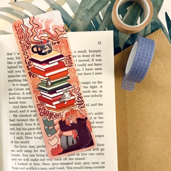 Stay on track with this delightful book-themed bookmark, adorned with a picture of a book to accompany your reading journey.