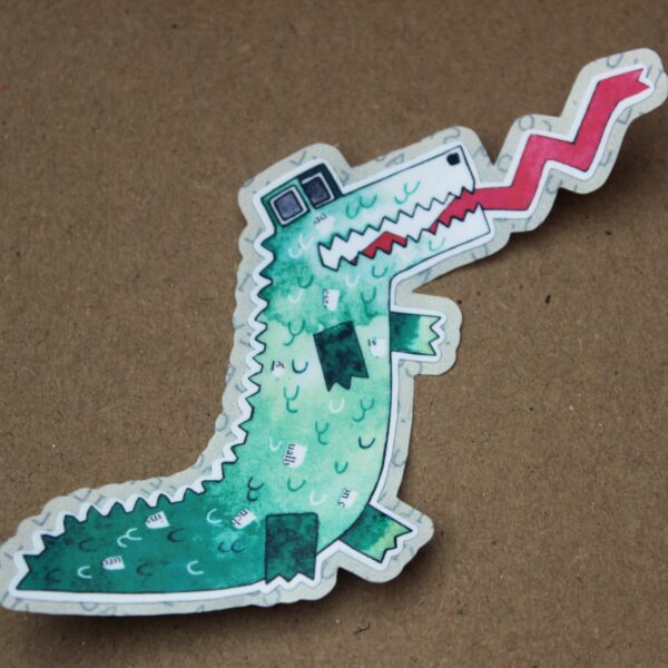 Get your hands on these awesome stickers! They showcase a green crocodile and are known as Mr. Crocodile Super Poppy stickers, easy to peel. He is hissing!