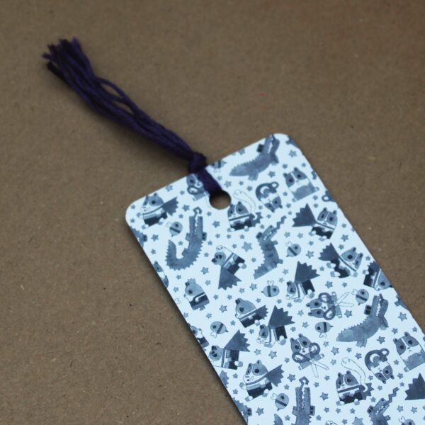 A cute super poppy bookmark with a purple tassle, perfect for adding a personal touch to any present.