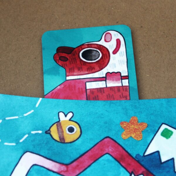 A small book with a picture of a bee and a crocodile. Includes a super poppy the guinea pig themed bookmark.